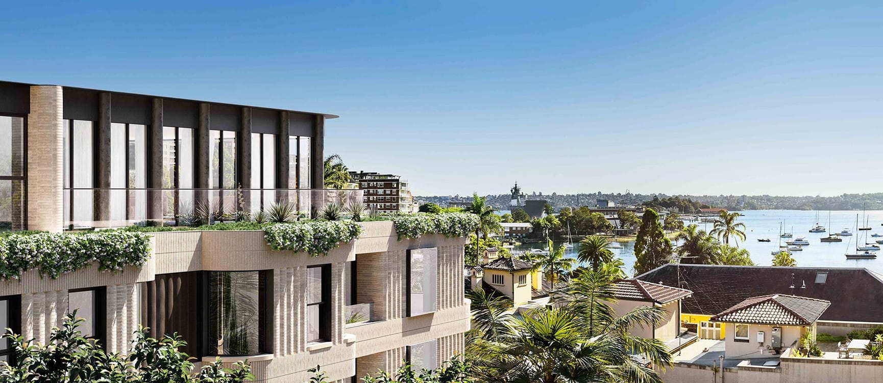 External view of apartment complex overlooking harbour