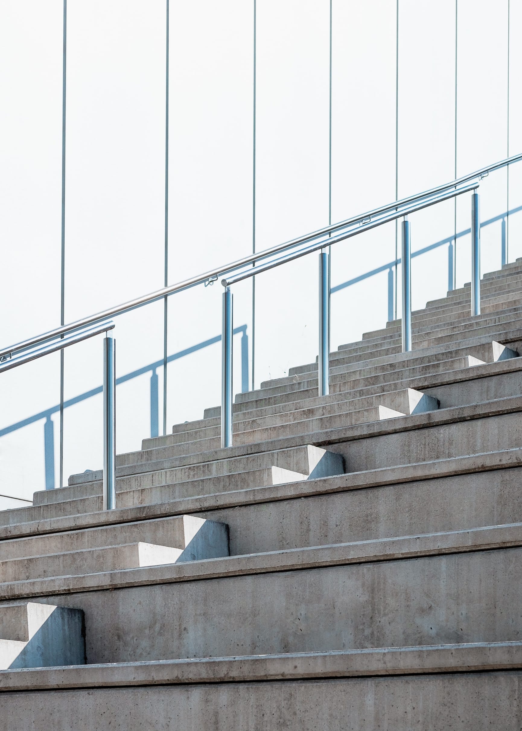 Cement staircase against white paneled background