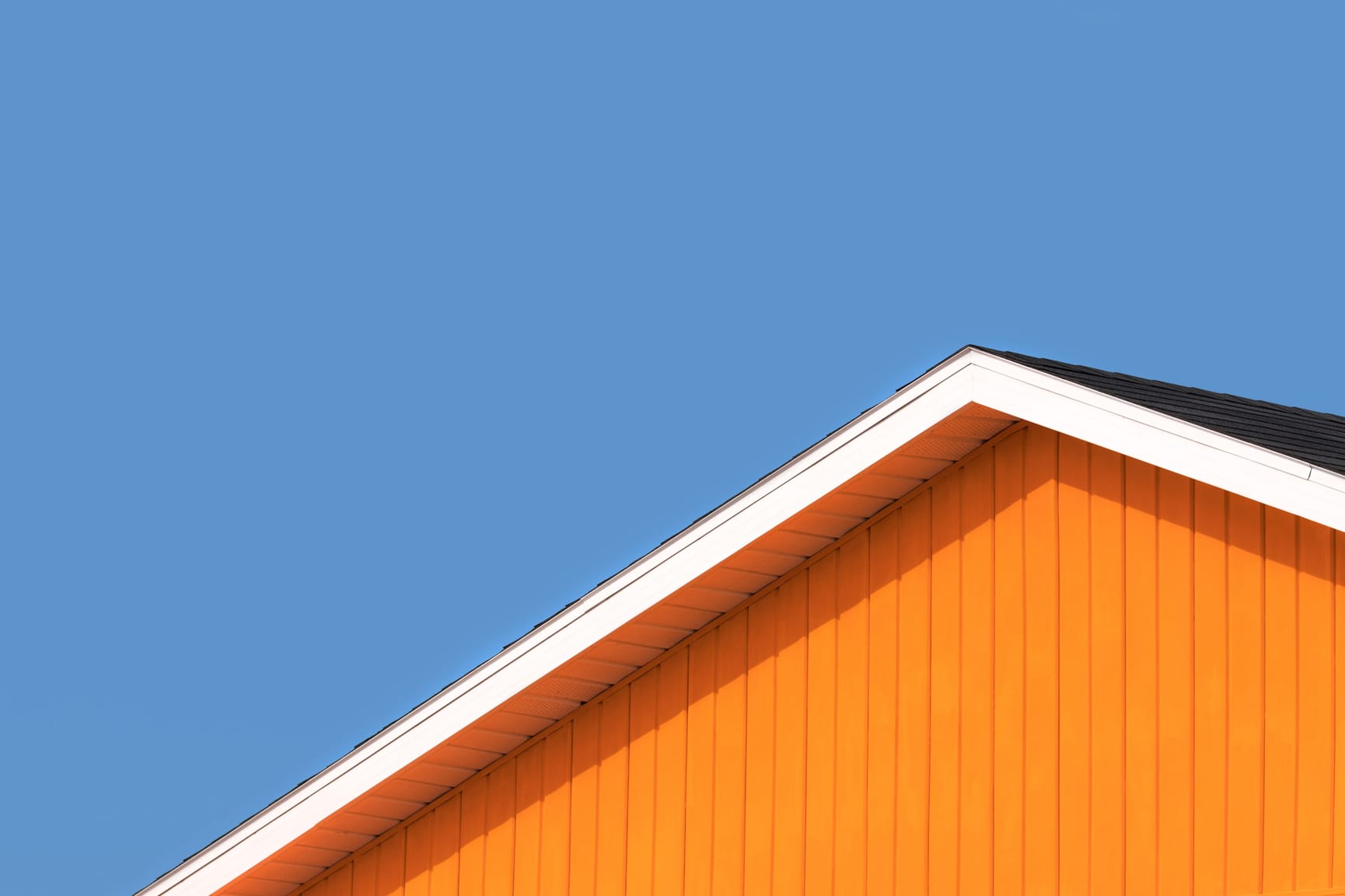 Orange roof with blue sky in the background